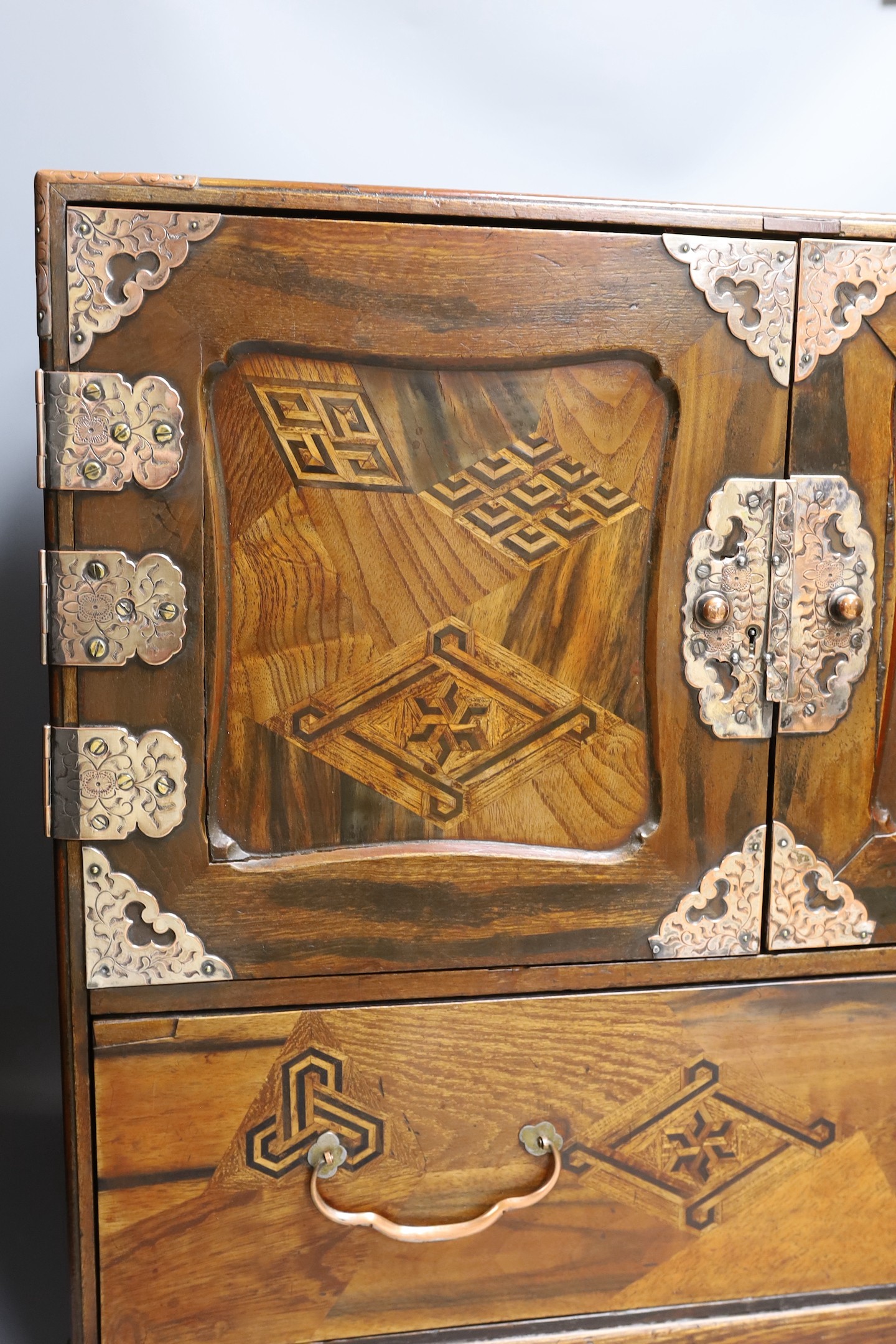 A 19th century Japanese Hakone parquetry table top chest, 55 cms wide x 46.5 cms high.